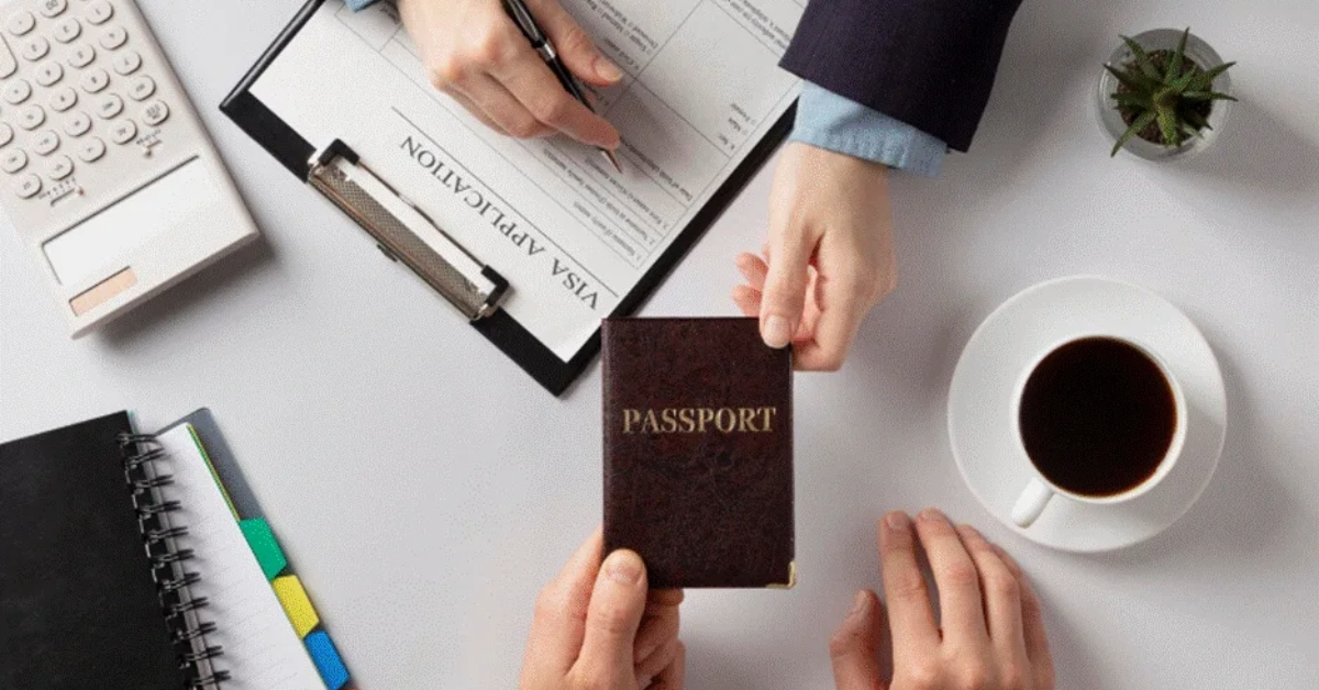 People filling visa application with a passport in hand