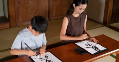 Woman and child practicing Mandarin