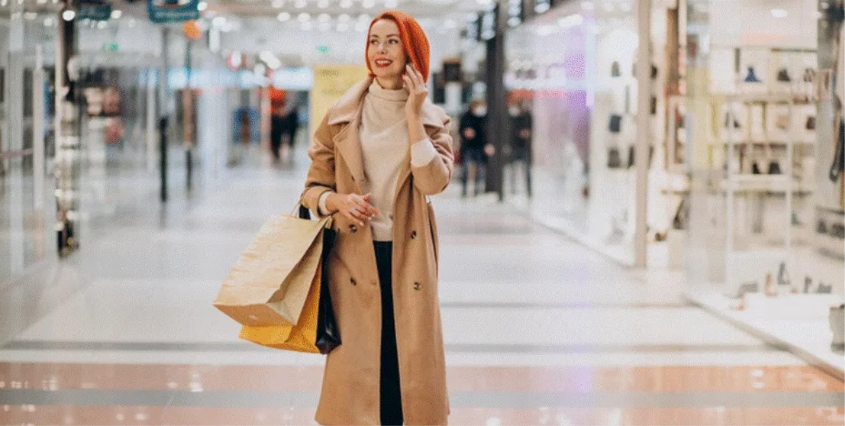 Woman talking on her phone while walking in an Abu Dhabi mall