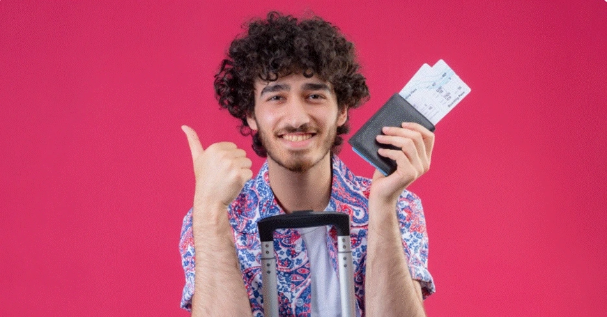 A person holds his visa and passport