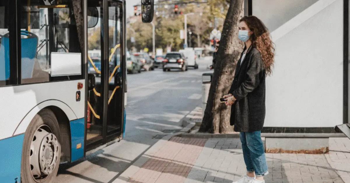 A person waiting for a bus in Abu Hail bus station