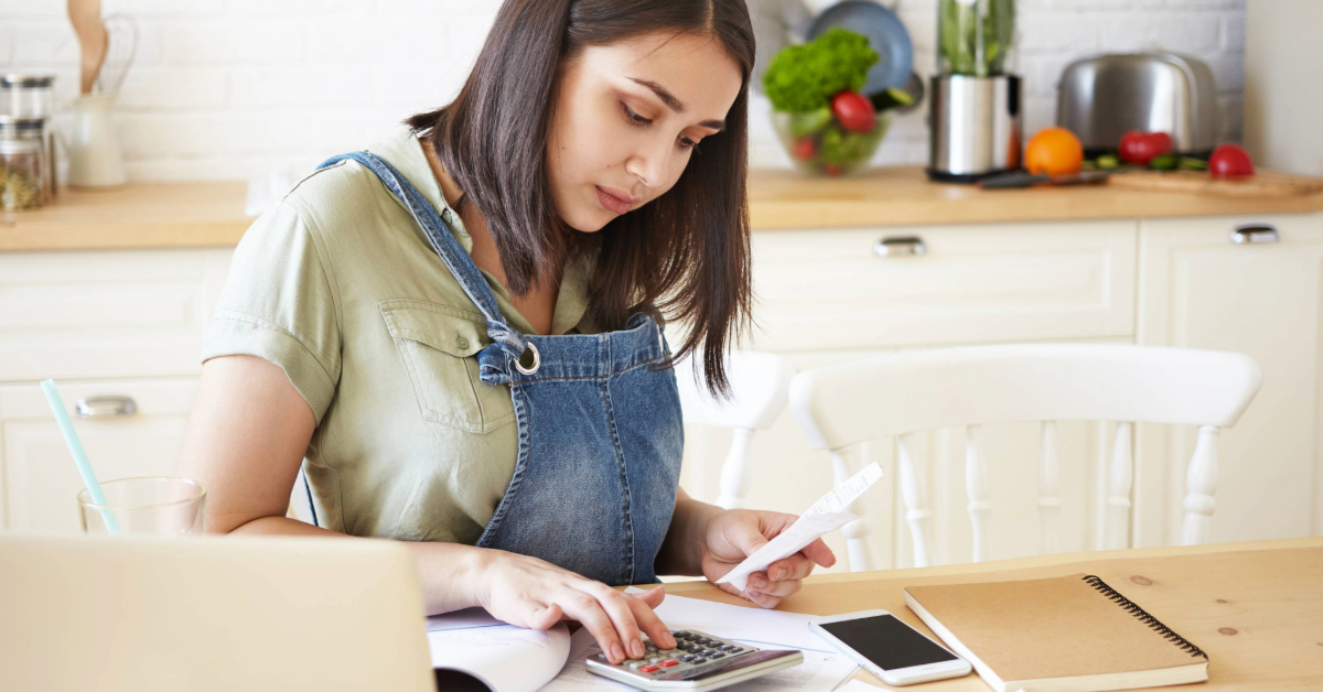 A woman tracking her budget to save money in Dubai