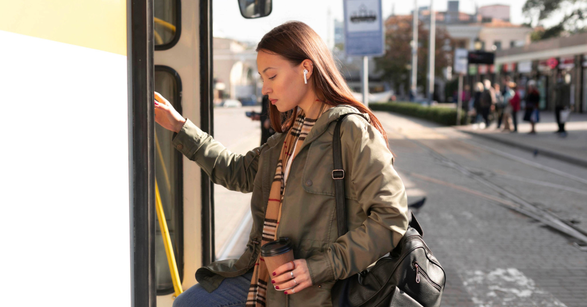 A woman boarding the F02 bus in Dubai