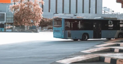 Blue bus leaving the station