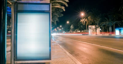 Bus stop illuminated at night