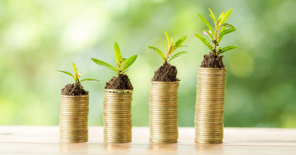 Coin on wooden table on blurred nature