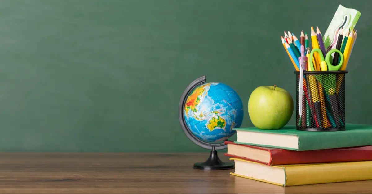 Education day arrangement on a table with copy space