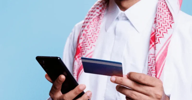 A man matching his Emirates ID card information and details on the phone