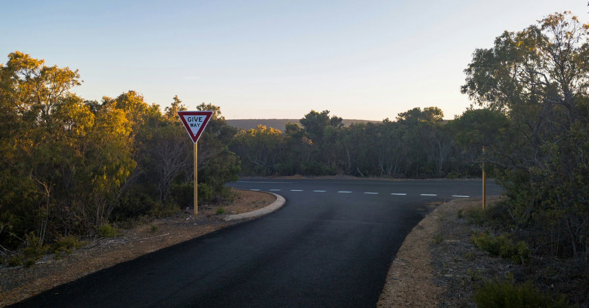 A triangular inverted &lsquo;GIVEAWAY&rsquo; sign by the roadside