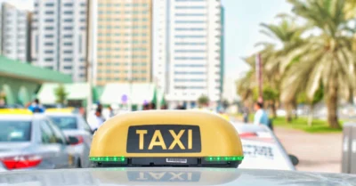 Taxi sign on top of the car