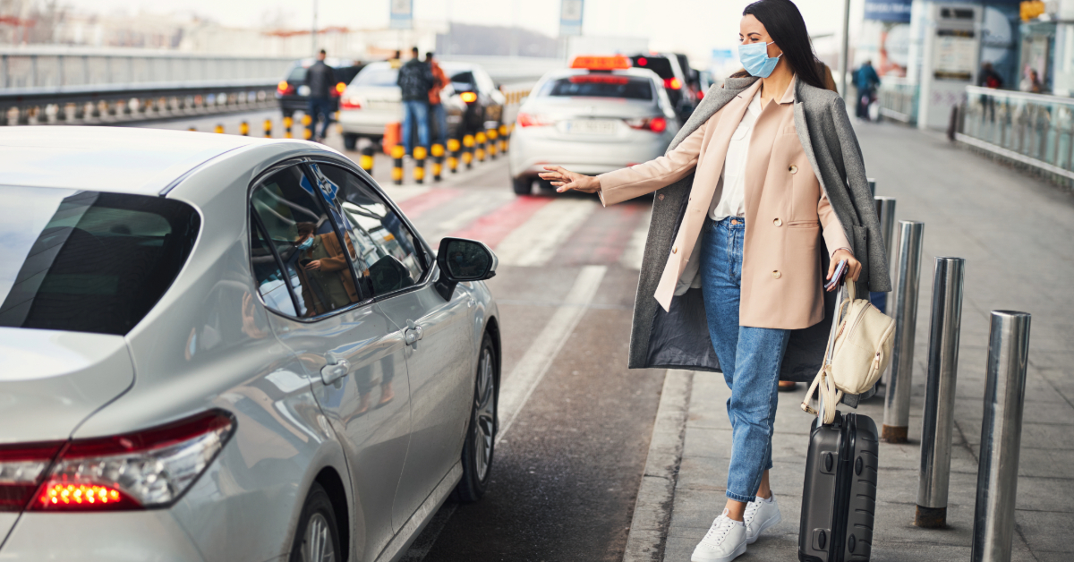 Woman taking a taxi at the airport