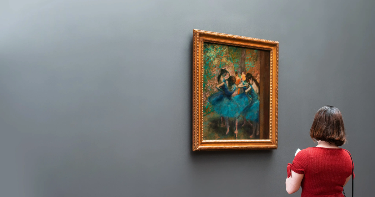 A woman checking out an art for investment purposes