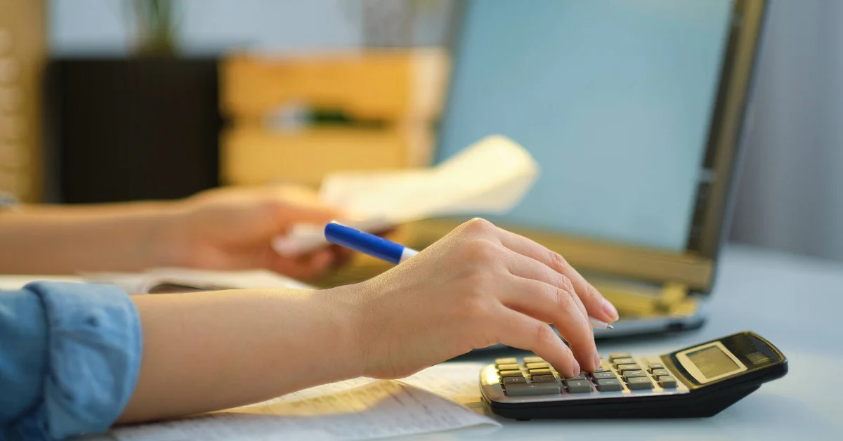 calculating his DEWA bills at home