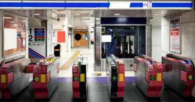 A metro station entrance with card-tapping machines