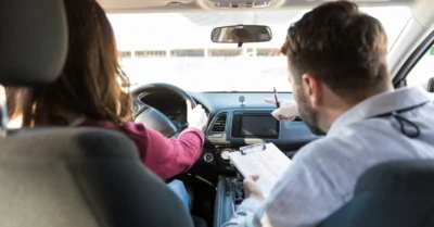 A woman doing a driving test