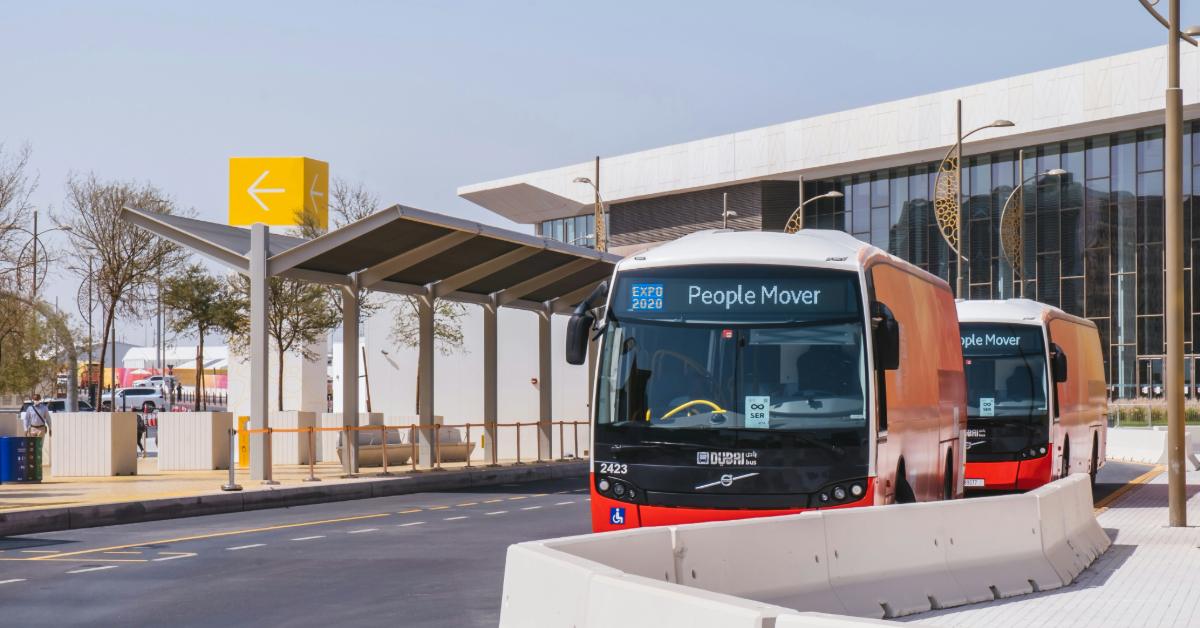 A feeder bus waiting at the bus stop