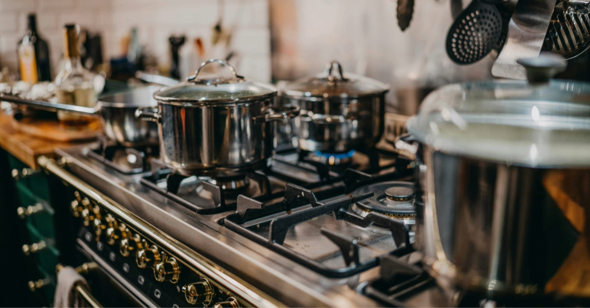 Stainless steel pots on a gas stove