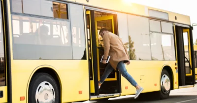 A man mounting the bus