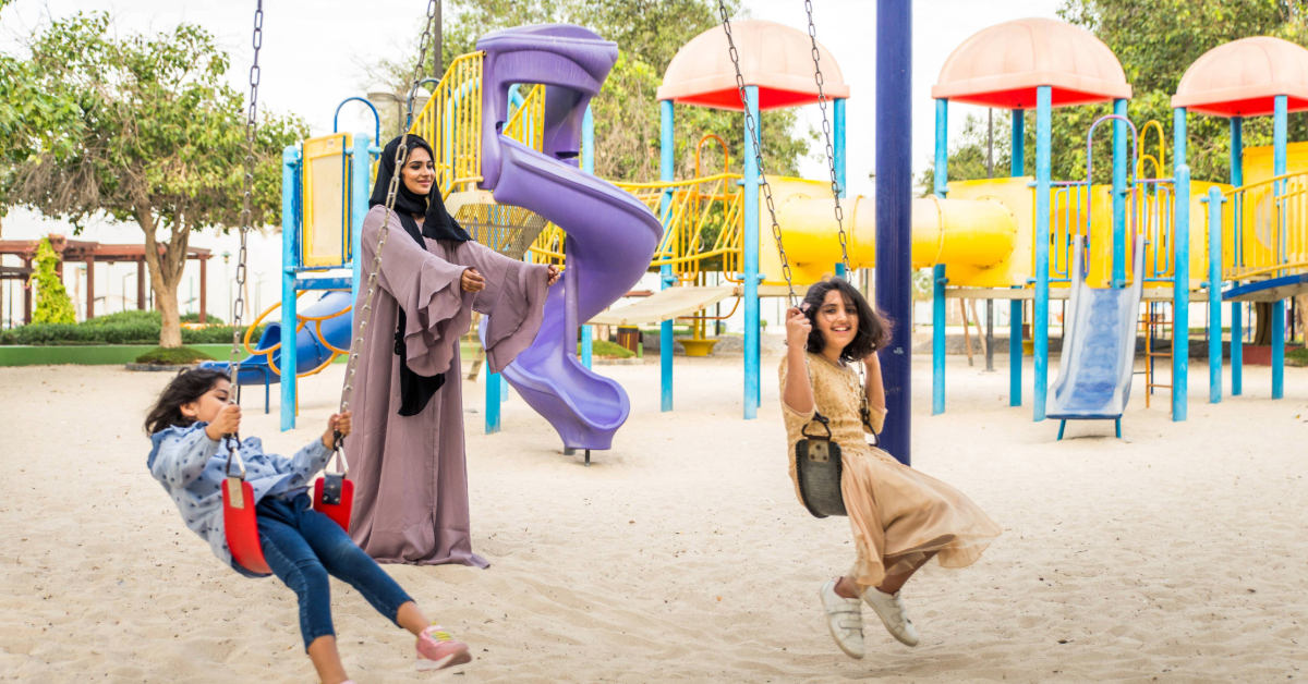 mother and kids having fun in the park
