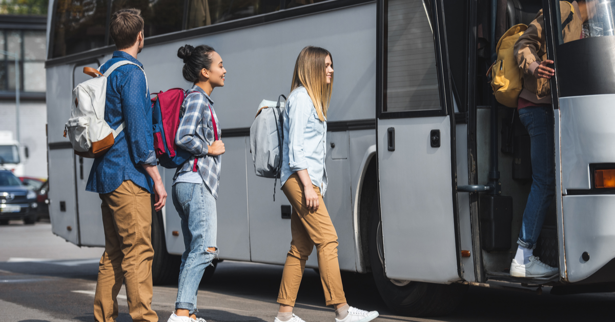 people mounting the bus