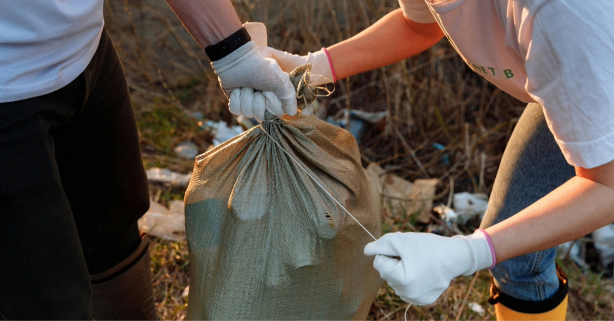 Junk being collected into trash bags by Take My Junk UAE