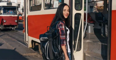 A woman boarding a F04 bus in Dubai