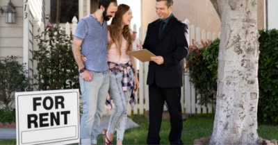 Couple signing papers for new house