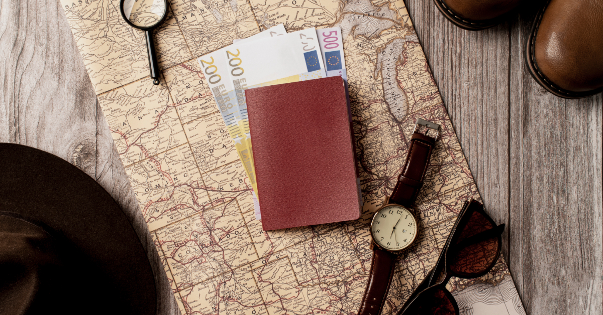 Iceland visa kept in a table along with money, a watch, and sunglasses