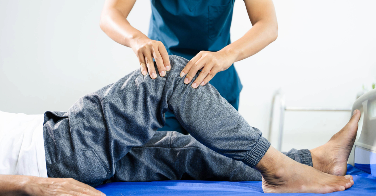 Physiotherapist training an injured patient