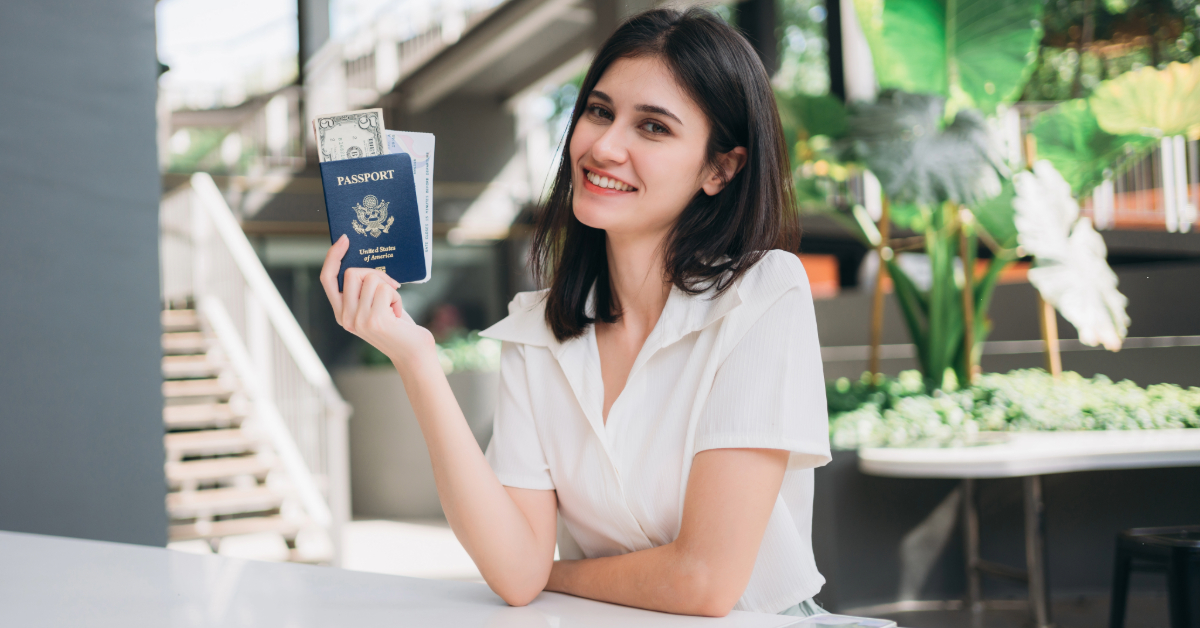 a woman holding her passport in VFS centre