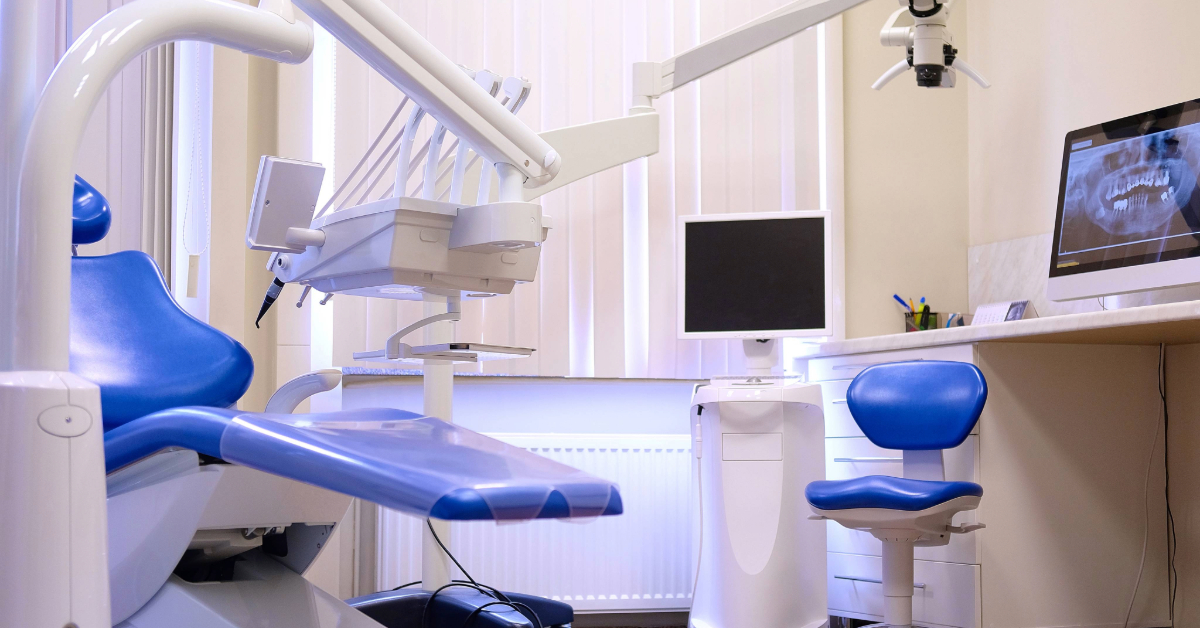 A dental examination private room with a chair and equipment