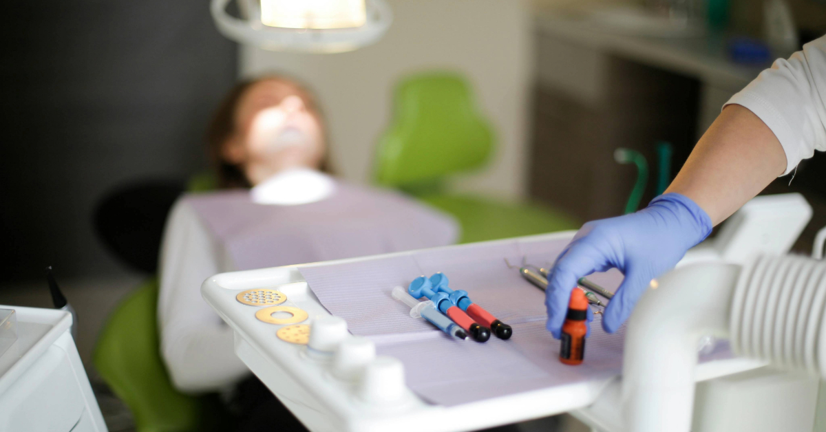 doctor using tools during dental surgery