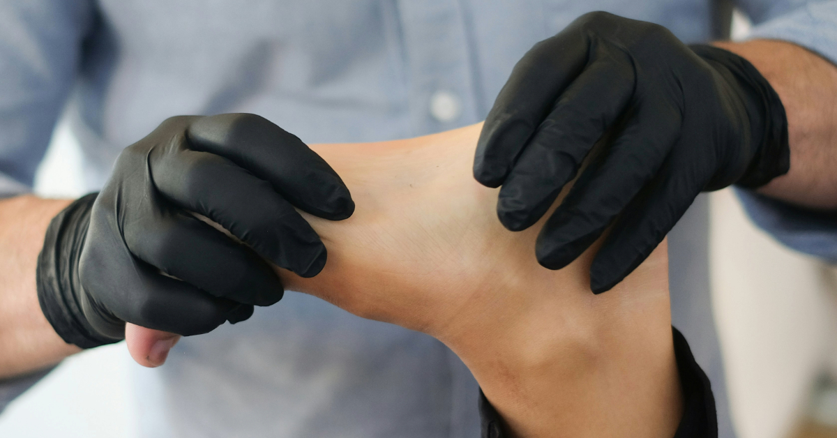 A doctor examining a patient’s foot