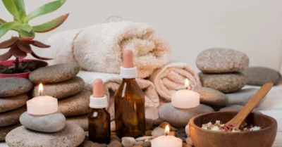 Arrangement with spa stones and lit candles