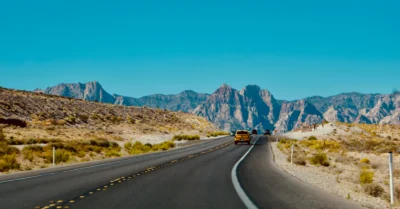A family going from Dubai to Saudi Arabia by road in a car