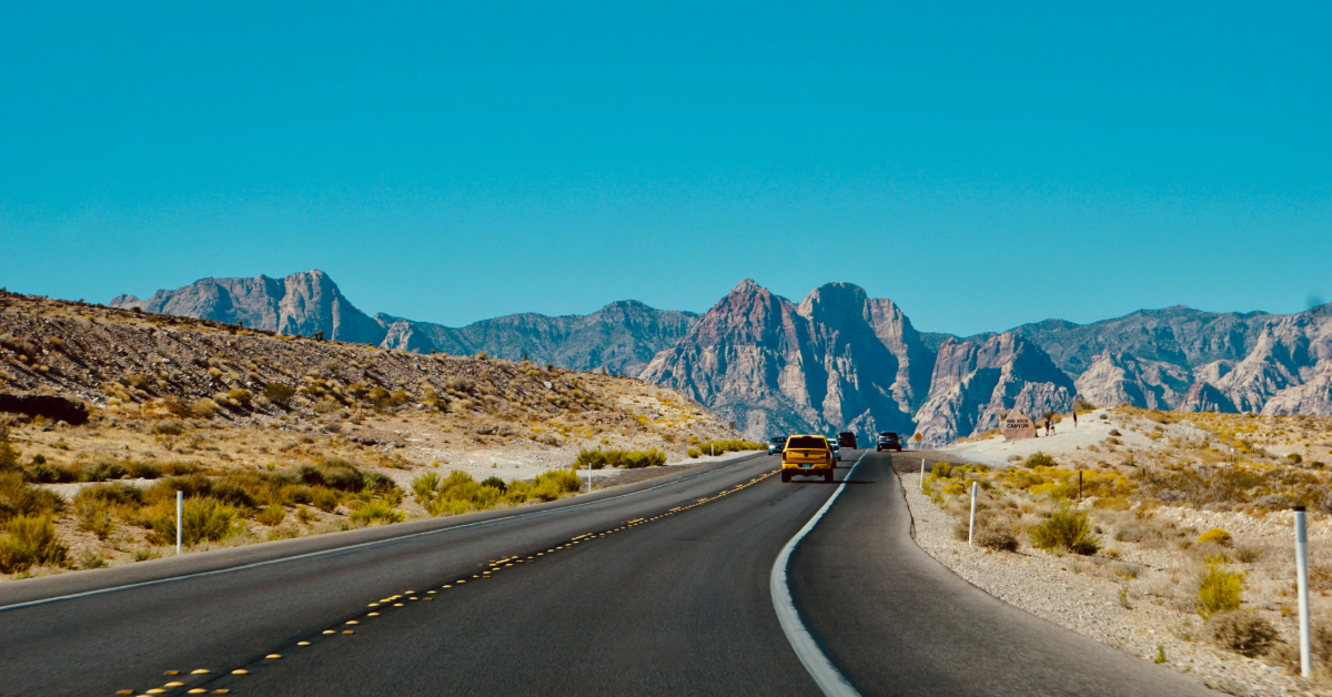 A family going from Dubai to Saudi Arabia by road in a car