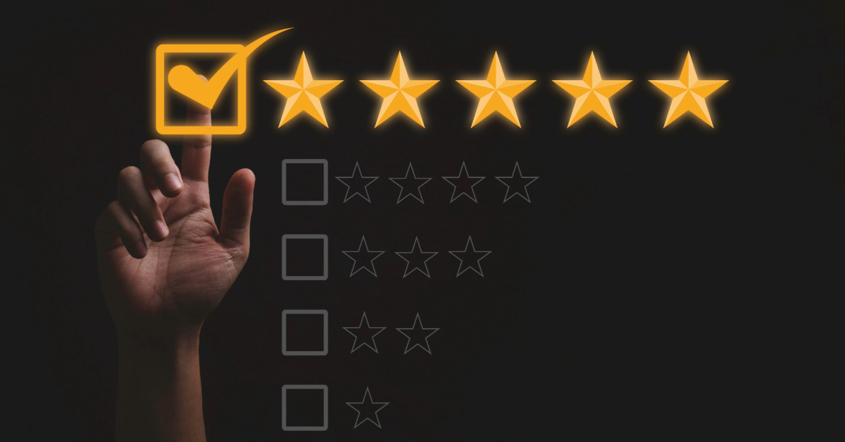 A hand pointing to a five star rating