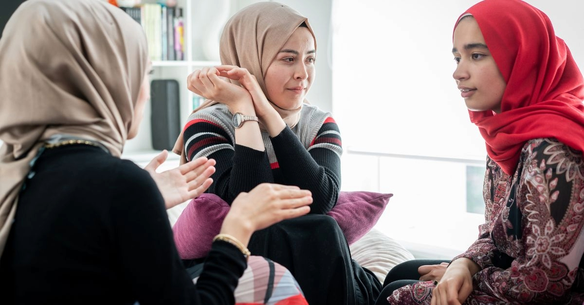 A group of hijabi women sitting together