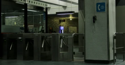 A metro entrance with a card tap station for passengers to enter