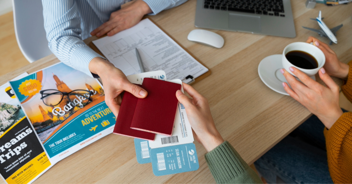 A person collecting their visa, passport, and boarding pass from an agent