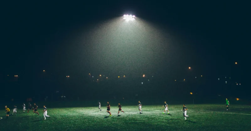 A team practising football at night