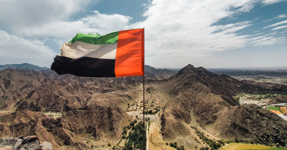UAE flag over mountains