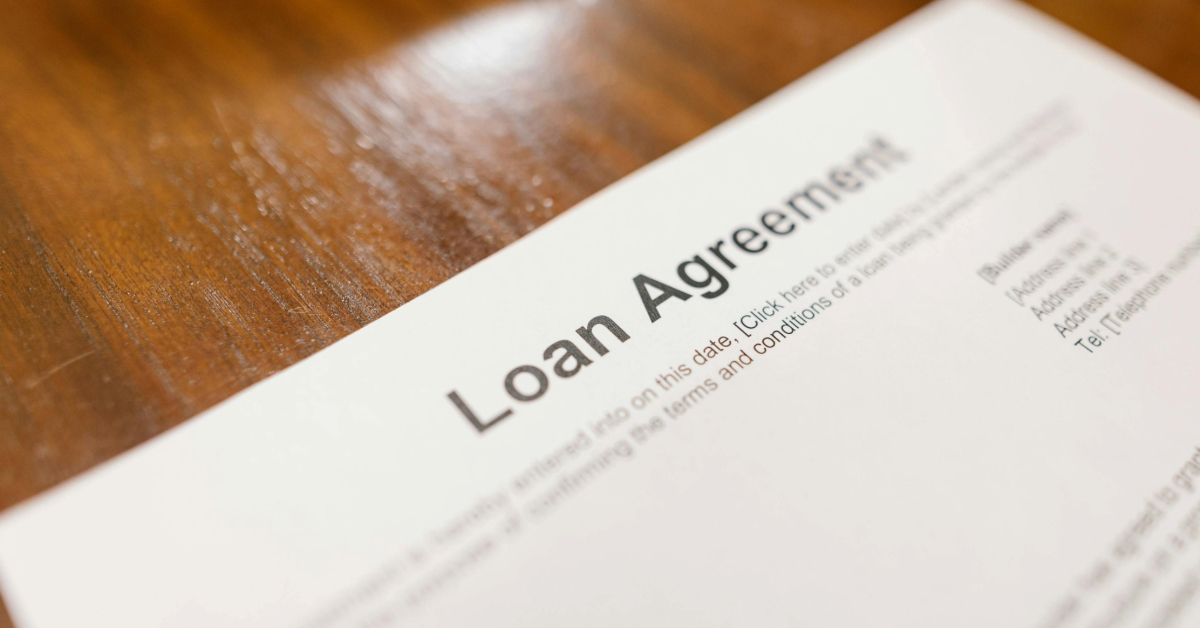 A loan agreement paper placed on a table