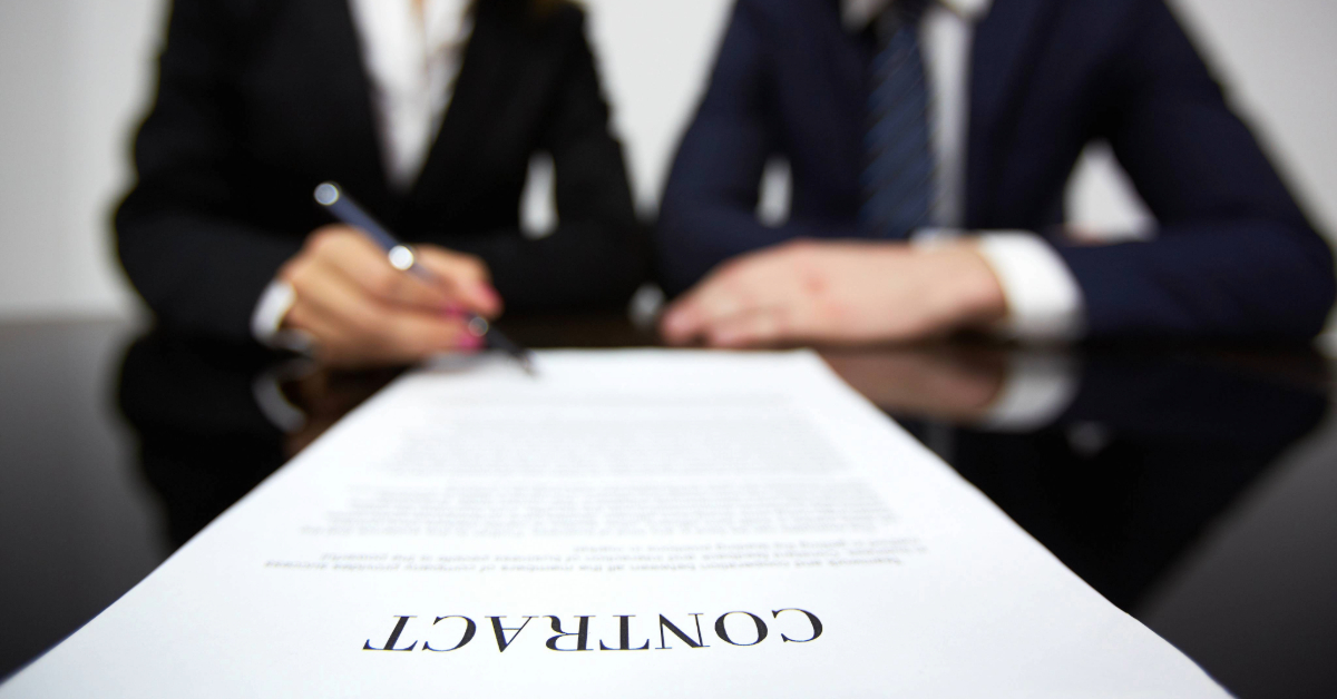 A man and a woman reviewing a contract together