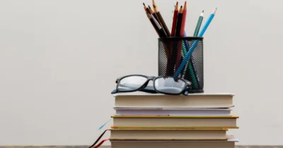 pencils in holder on wooden table