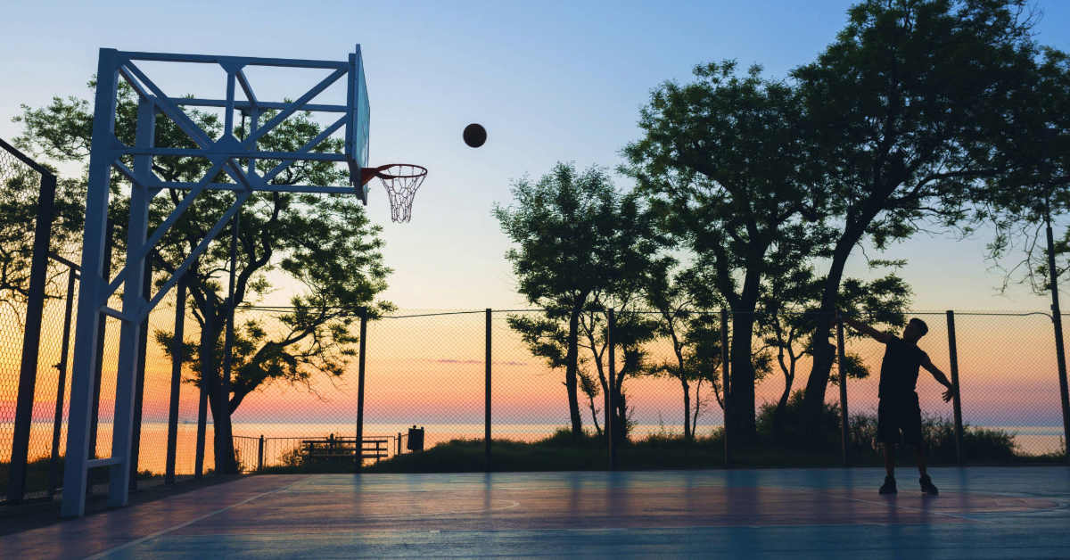 Individual playing basketball