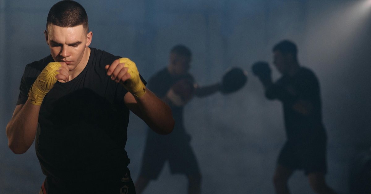 Boxers training kickboxing in the ring