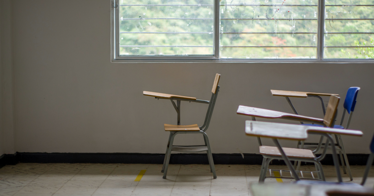 School chairs in a classroom near the window
