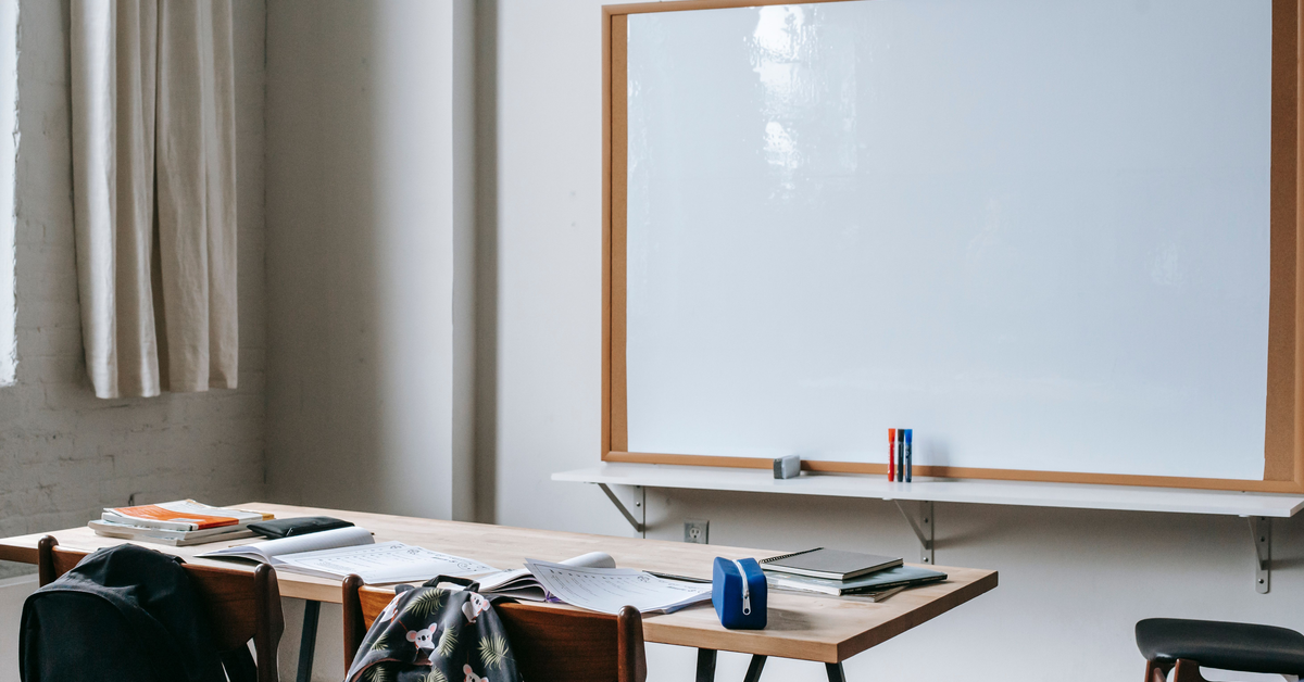 Modern classroom with chairs and a whiteboard