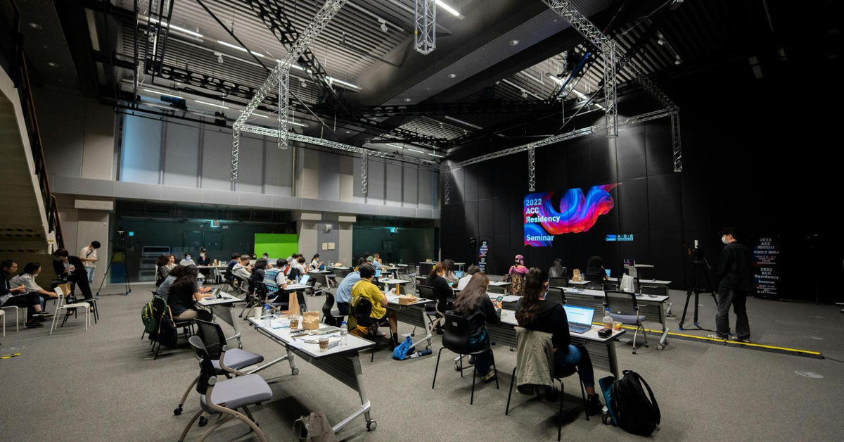 Interior of a luxury auction house in Dubai featuring digital displays and high-end decor